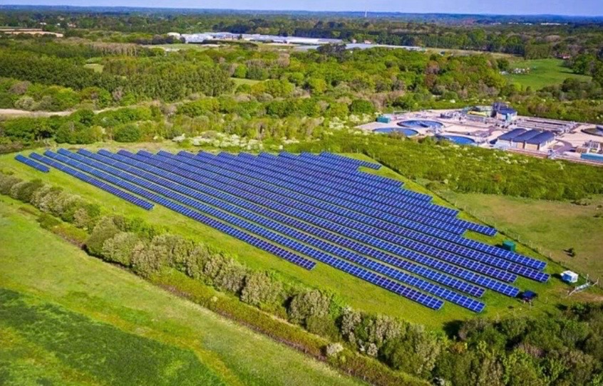 Aerial view of solar farm showing renewable energy infrastructure and economic development opportunities in DeWitt